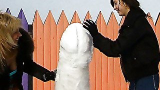 Two girls and a snow man