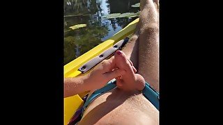 Hairy daddy long legs pumps his tight uncut cock in a kayak