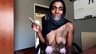 Desi in hijab smoking while wearing nipple clamps