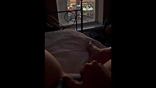 Sunset playing alone in hotel bed