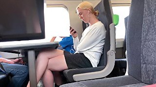 Blonde with beautiful legs on the train