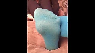 Toe wiggling in thin blue socks