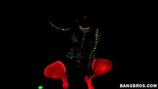 Neon babe dances in black light and sucks dick