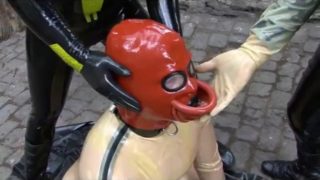 Latex Couple With Rubber Slave In Transparent Catsuit Drinking Femdom Piss