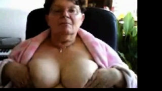 naughty granny flashing her big tits on cam