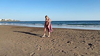 Girl Walking on the beach and flashing body on public