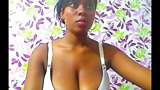 Amateur dark skinned cam nympho was teasing her own big melons