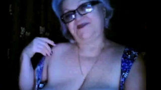 Russian granny ex-teacher flashing her big tits on  webcam