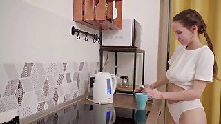 Russian cutie with natural tits masturbates in the kitchen