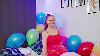 Balloon popping teaser shows her big naturals as well