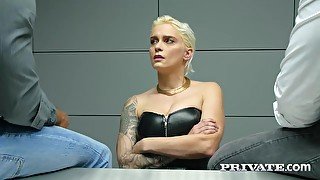 Inked blonde babe, Mila Milan is sucking two cocks during an interrogation in a police station