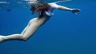 Underwater romantic nude swimming