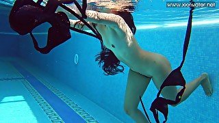 Underwater beauty stripping and swimming in the nude