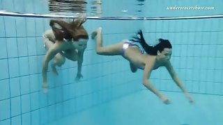 Girls tear off their bikinis underwater