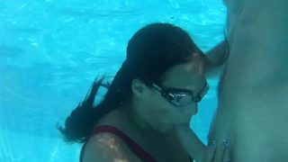 Submerged underwater with a dick inside her