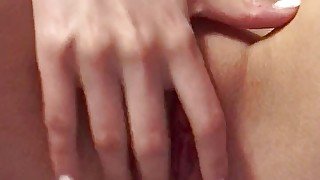 Fingers caressing a wet pussy