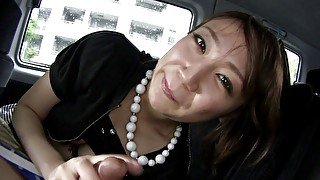 Adorable Japanese cutie munches a hard dick in a car