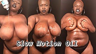 Slow Motion of BBW Rubbing Oil on Natural Black Tits & Curvy Body