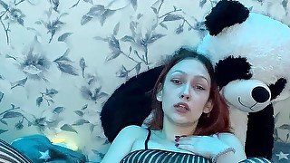 Red-haired girl in bodstockings jerks on pussy