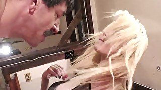 junior blonde girl spitting and man boot licking