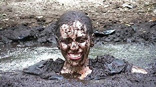 Busty Samantha gets very dirty outdoors in pool of mud