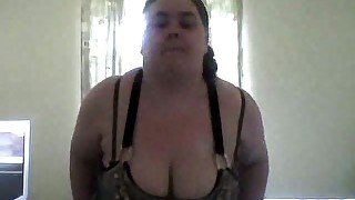 Fugly brunette bitch with huge saggy boobs strips for me on webcam