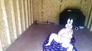 Bunny masturbates in the shed