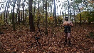 Giant fake tits cross dresser naked and exposed in a public wood masturbating cum shot