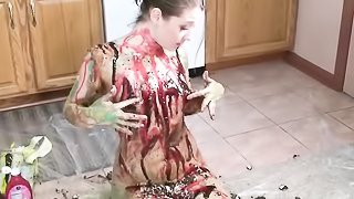 Juicy brunette slut with big perky ass plays in the kitchen floor using strawberry and chocolate syrup and covers her body with different colors