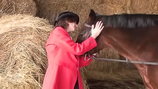 Mature chick Judi fingers her gaping cunt in a barn