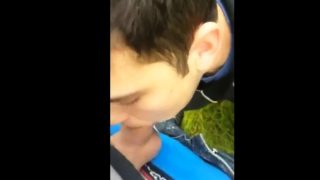 Twink sucking cock in the park and getting the cum