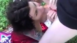 Tatooed slut jerking off several guys in the woods