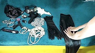 Long ASMR Mistress in leather leggings is choosing devices for her slave