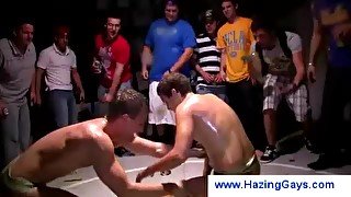 Students wrestling during an initiation