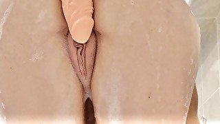 Slut plays with herself in the bathtub