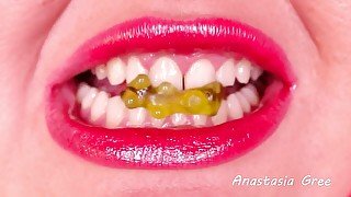 Sharp white teeth close up - Biting gummy bears