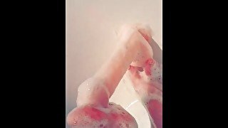 Soapyfootjob with toy in shower