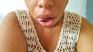 Ebony girl sucks her fingers suggestively and tries to make you horny with her wet mouth