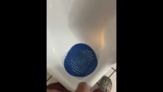 Pissing into a Urinal