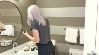 Flat chested blonde plays with her cunt in the bathroom