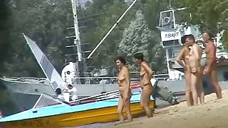 Hot beach voyeur video shows mature nudists enjoying each others company.