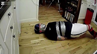 Footballer tied and taped tight on kitchen floor ALTERNATIVE VIEW