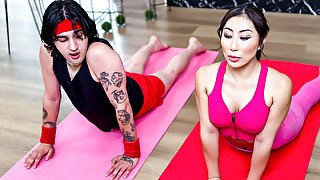 Tattooed man with long hair is working out with an Asian