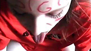 Horny teen with face paint sucking on a wang