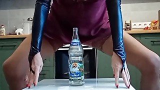 Perverse milf riding on the big bottle