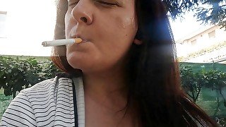 Sexy smoking a garden