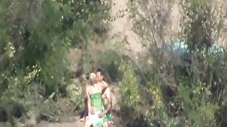 Hot spy video featuring one couple making love in the bushes