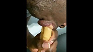 Sucking a dildo