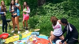 Naughty babes merge bodies and start touching pussies at picnic