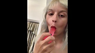 Transgirl sucks on her new dildo